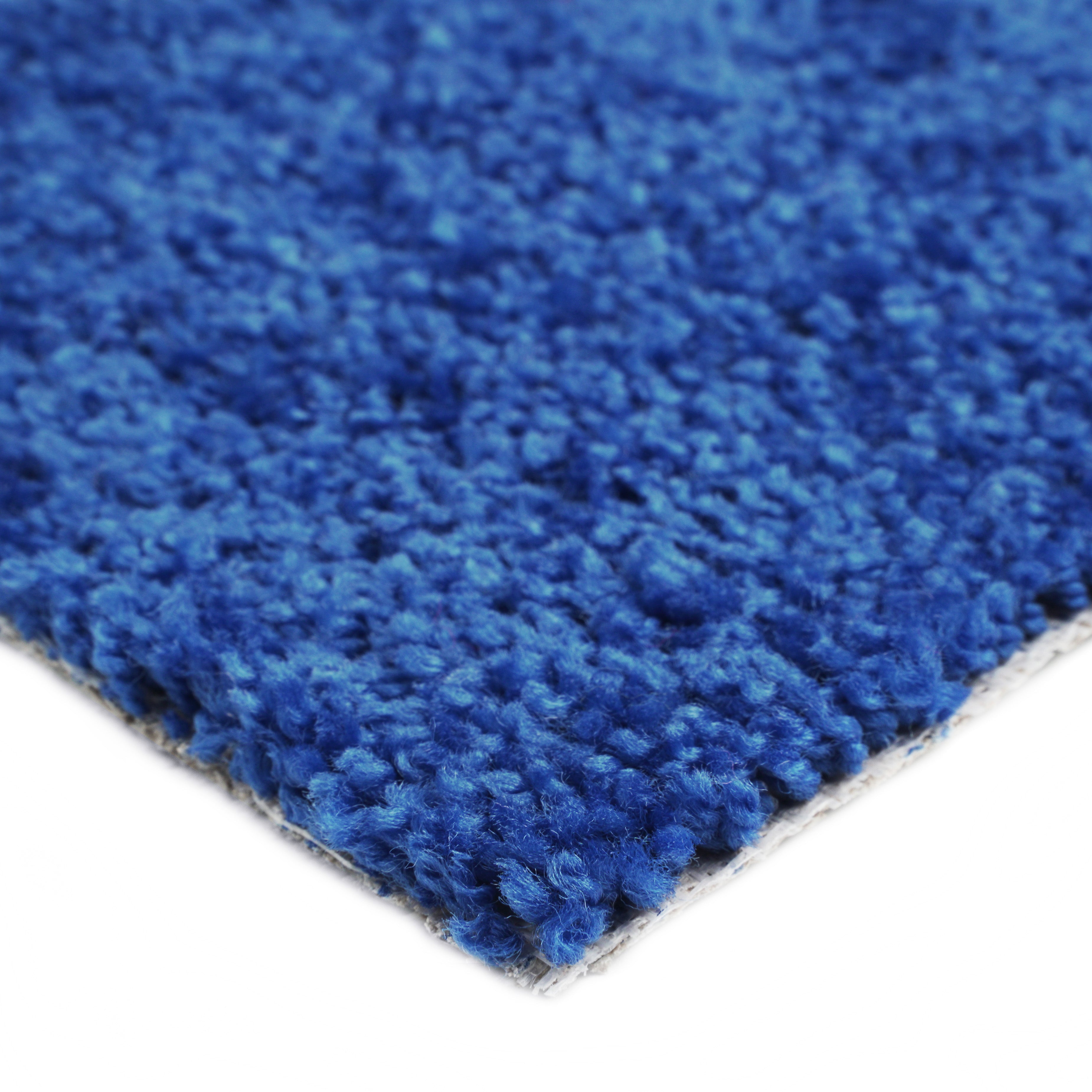 Soft blue area rug, made of plush fibers, perfect for adding comfort to any living space.